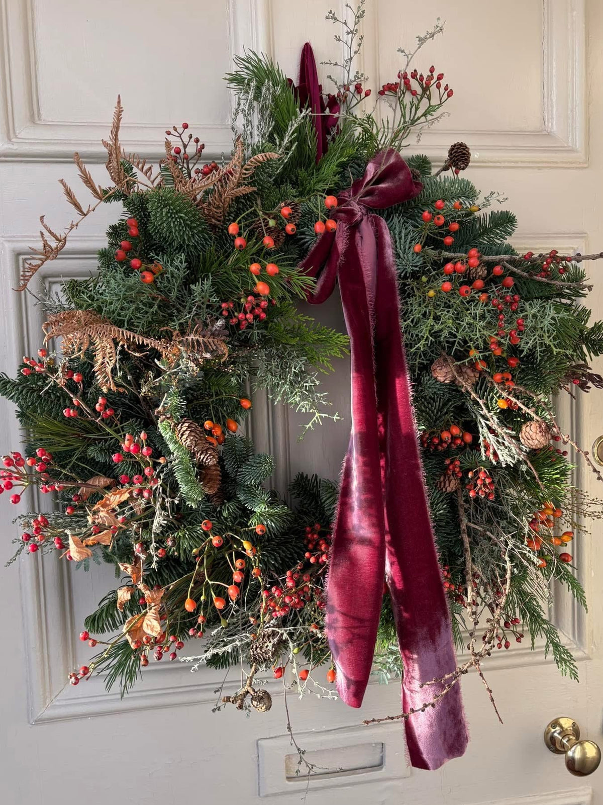 Seasonal hand made wreath with velvet ribbon. Made in East Lothian